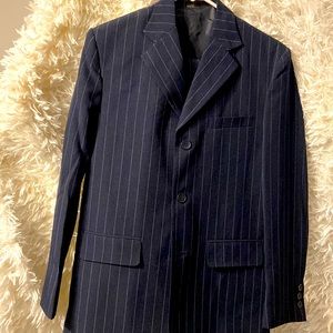 Brand new pin stripe navy blue suit. Jacket, vest and pants.